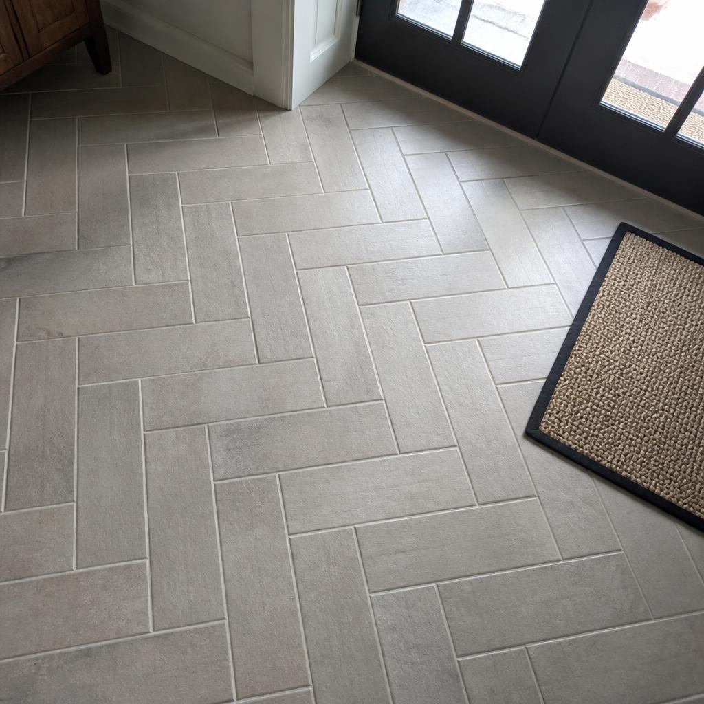 Herringbone tile floor in a home entryway